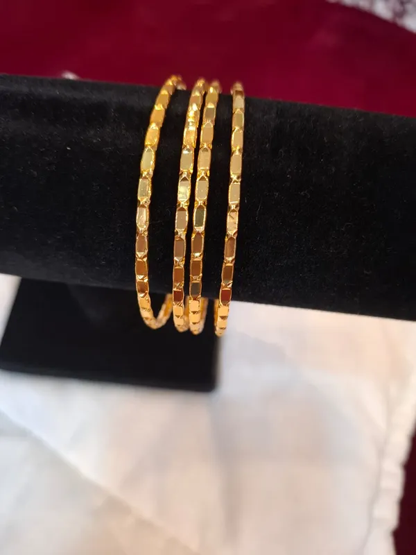 Gold_Metal_Textured_Slim_Bangle_Set_Of_4_For_Women