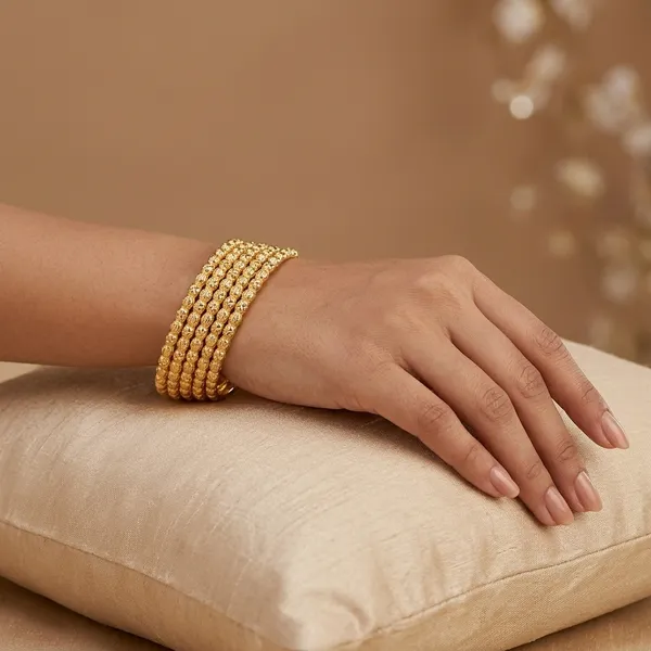 Gold_Metal_Textured_Bangle_Set_Of_4_For_Women