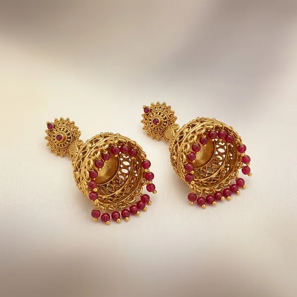 Gold_Antique_Metal_Jhumka_Earrings_With_Red_Beads