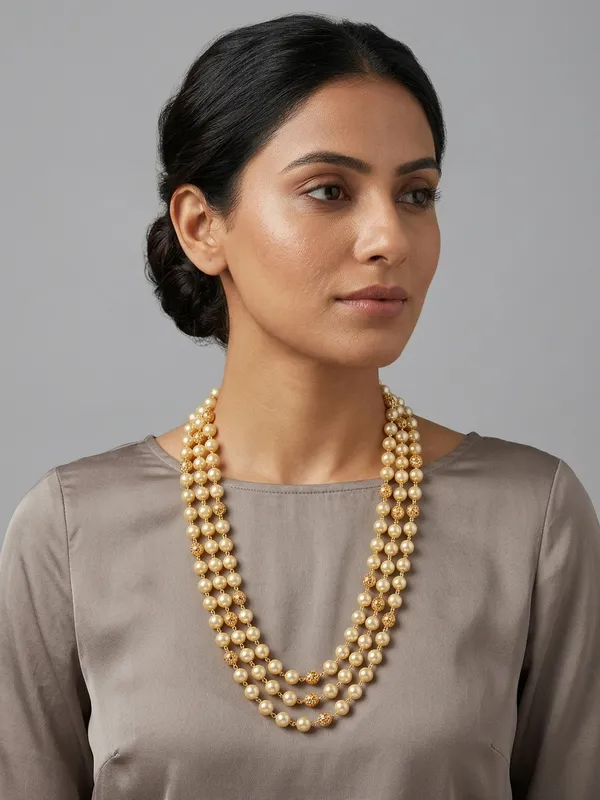 Three-Strand_Cream_Pearl_Necklace_with_Textured_Gold_Spacer_Beads