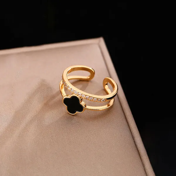 Gold_Stainless_Steel_Adjustable_Black_Clover_Ring_For_Women_(RGSS-28)