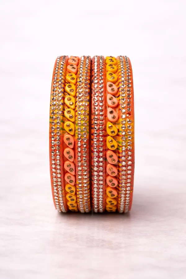 Orange_And_Yellow_Lac_Silk_Thread_Stone_Embellished_Bangle_Set_For_Women