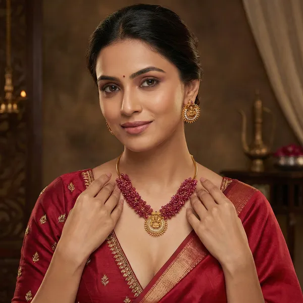 Gold_Plated_Lakshmi_Motif_Stud_Earrings_With_Crystals