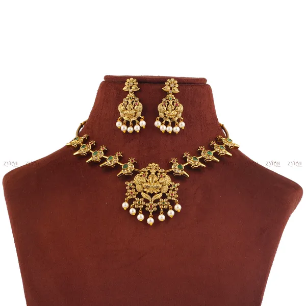 Gold_Lakshmi_Temple_Necklace_Set_With_Emerald_And_Ruby_Accents
