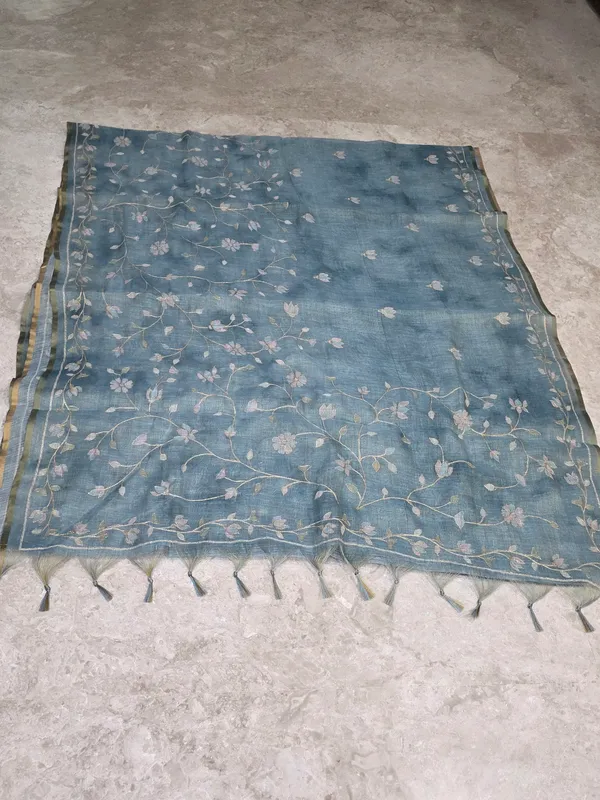 Pastel_Blue_Linen_Tissue_Floral_Embroidered_Golden_Border_Saree_For_Women