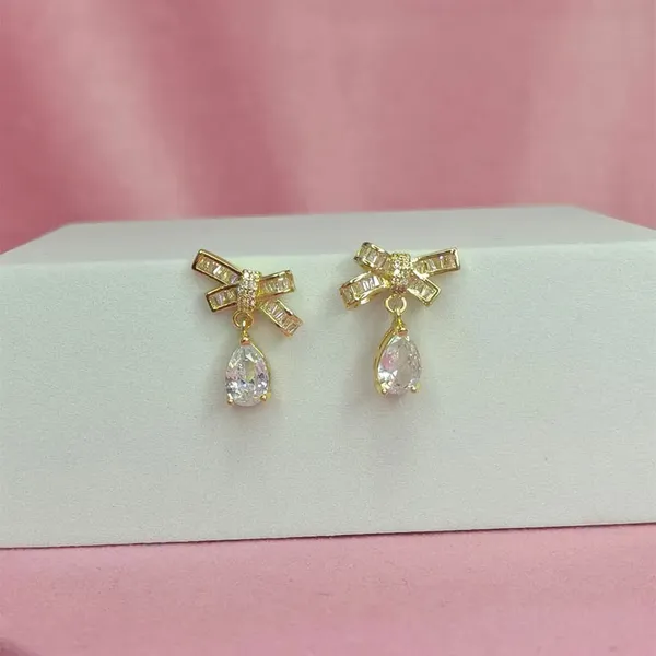 Gold_Alloy_American_Diamond_Bow_Stud_Earrings_For_Women