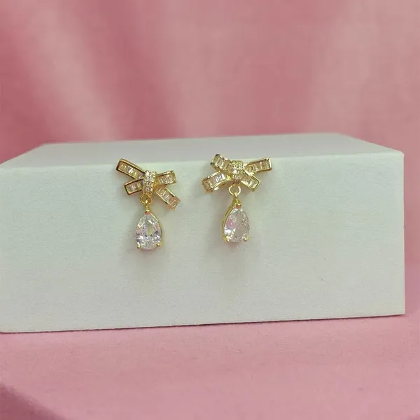 Gold_Alloy_American_Diamond_Bow_Stud_Earrings_For_Women