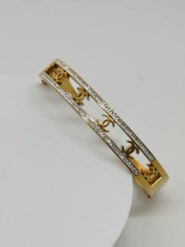 Gold-Tone_Cutout_Design_Bangle_with_Crystal_Embellishments