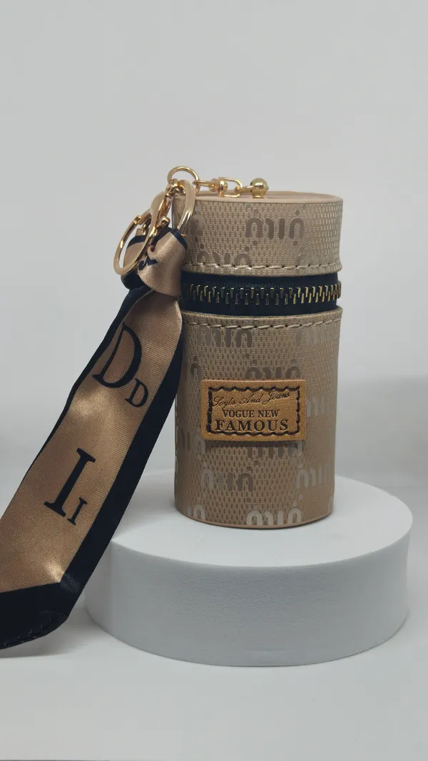 Beige_Monogram_Cylinder_Bag_with_Ribbon_Strap