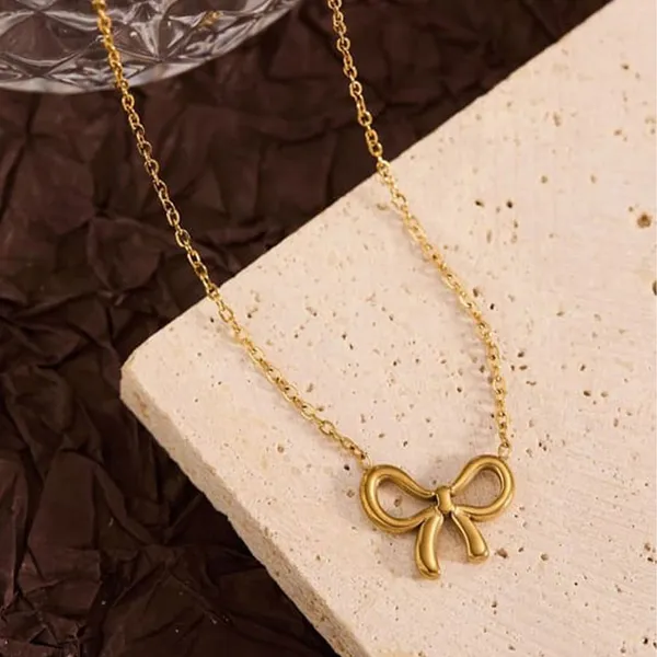 Gold_Alloy_Bow_Pendant_Infinity_Chain_Necklace_Set_For_Women