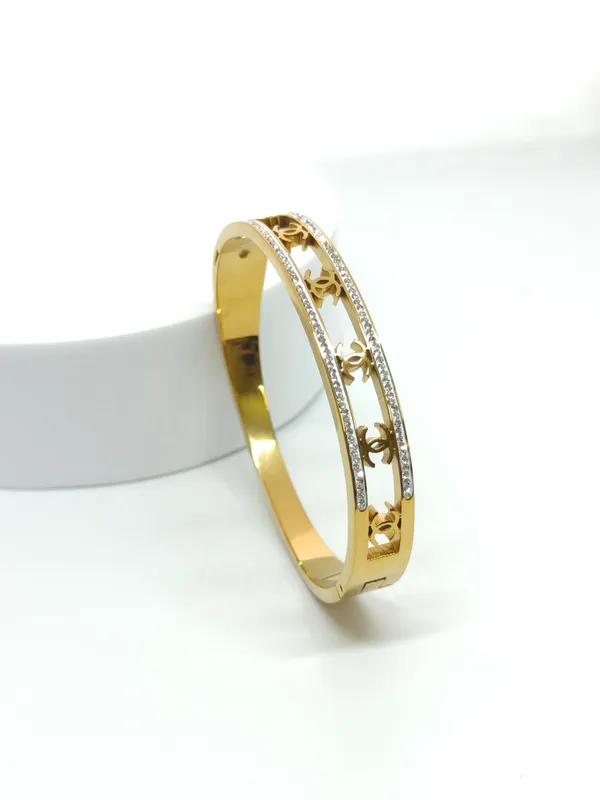 Gold_Tone_Stainless_Steel_Bangle_with_White_Enamel_and_Crystal_Accents