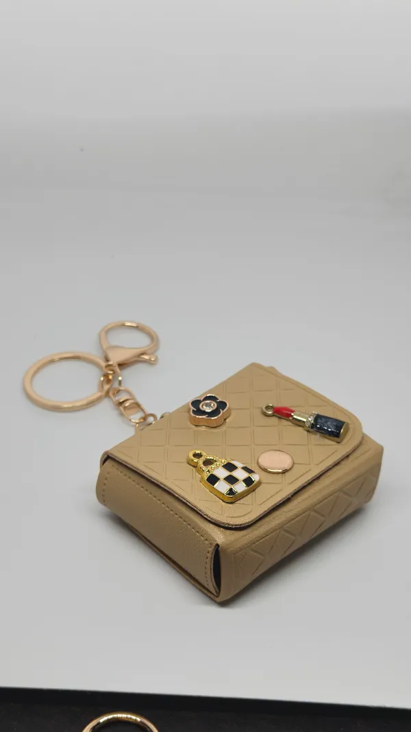 Beige_Quilted_Mini_Bag_Keychain_with_Decorative_Charms