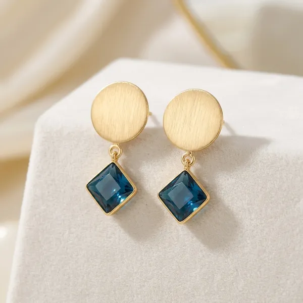 Gold_Brushed_Disc_Earrings_with_Blue_Crystal_Drop