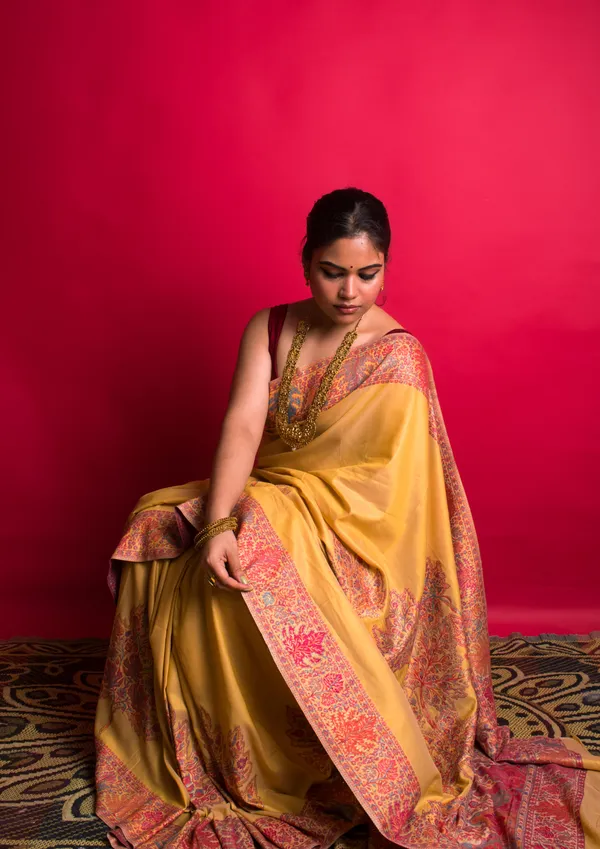 The_Autumn_Gold:_Golden_yellow_Mulberry_silk_saree_with_vibrant_autumn_Chinar_leaves