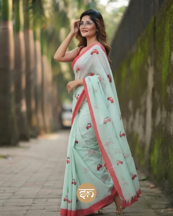 Raahi:_Mint_Green_Pure_Mul_Cotton_Saree_with_All-Over_Taxi_Scooty_Printed__Work