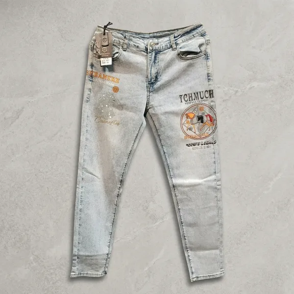 Light_Blue_Denim_Relaxed_Fit_Distressed_Embroidered_Patch_Jeans_For_Men