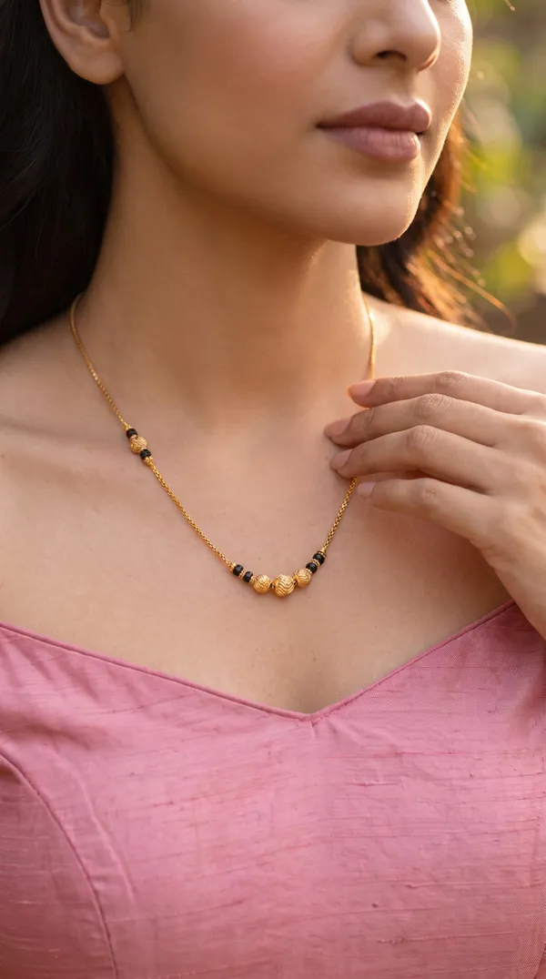 Golden_Noir_Asymmetric_Bead_Chain_Necklace_with_Sculpted_Gold_Accents_for_Women