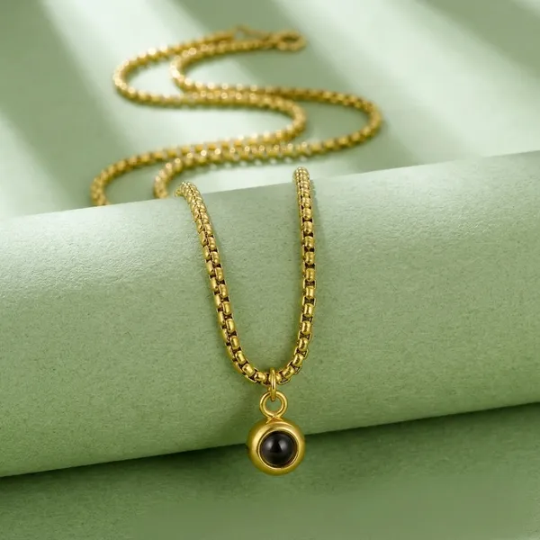 Gold_Tone_Chain_Necklace_With_Dark_Stone_Pendant_For_Women