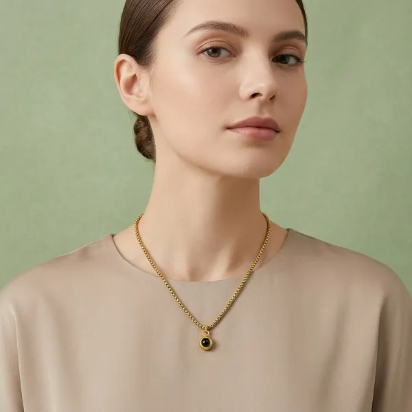 Gold_Tone_Chain_Necklace_With_Dark_Stone_Pendant_For_Women