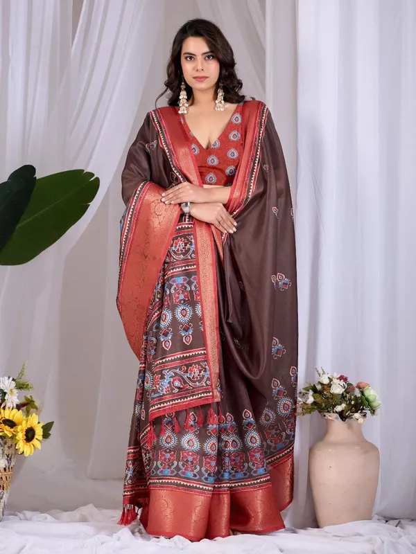 Brown_And_Red_Lichi_Silk_Ethnic_Motif_Printed_Woven_Border_Saree_For_Women