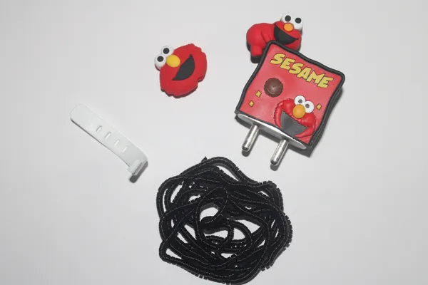 Elmo_Sesame_Street_Silicone_Charger_Cable_Protector_Set_Of_4-_Only_for_Iphone_(18-20_Watt_Charger)