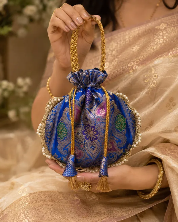 Royal_Blue_Banarasi_Brocade_Potli_Bag_with_Pearl_Border_&_Golden_Tassels