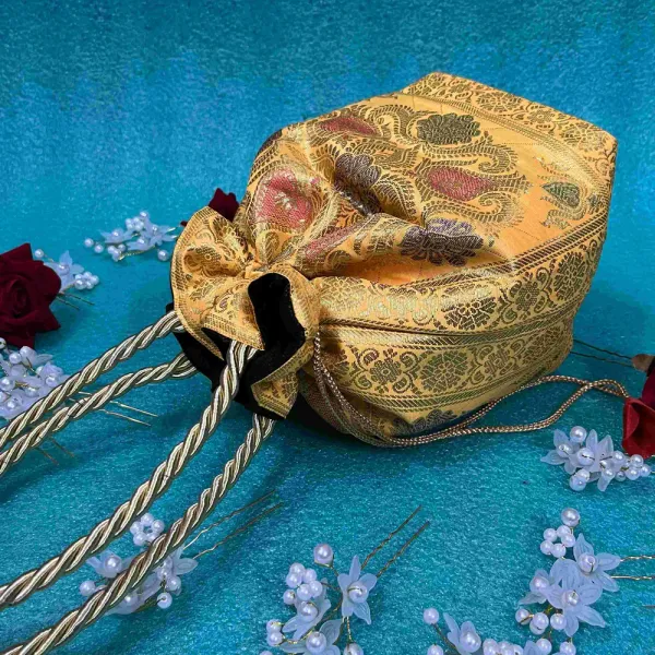 Yellow_Banarasi_Silk_Brocade_Braided_Handle_Potli_Bag_For_Women