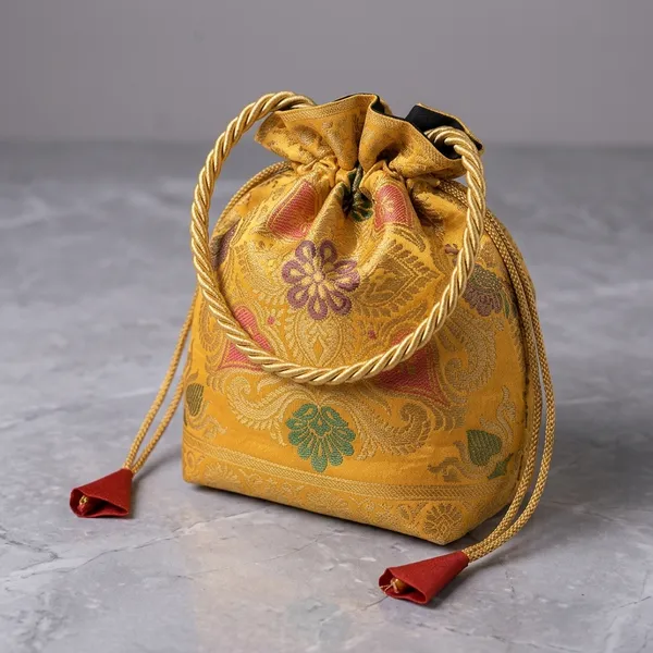 Yellow_Banarasi_Silk_Brocade_Braided_Handle_Potli_Bag_For_Women