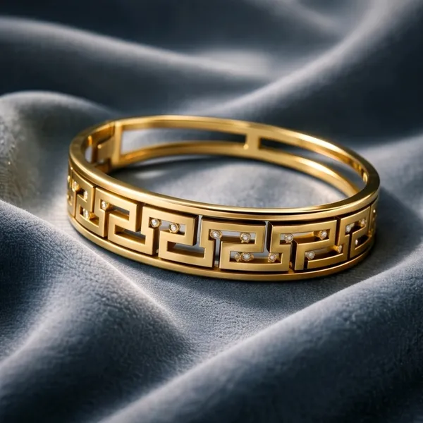 Gold_Toned_Greek_Key_Pattern_Bangle_With_Crystal_Accents