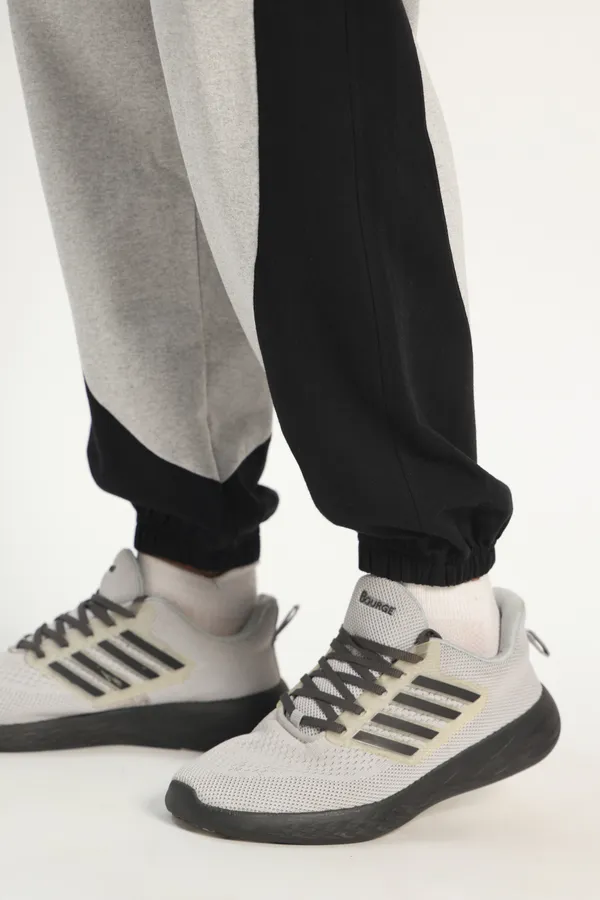 HYPE_BORN__Grey_Melange_&_Black_Color_Block_Sweatpants_with_Elastic_Cuffed_Hem