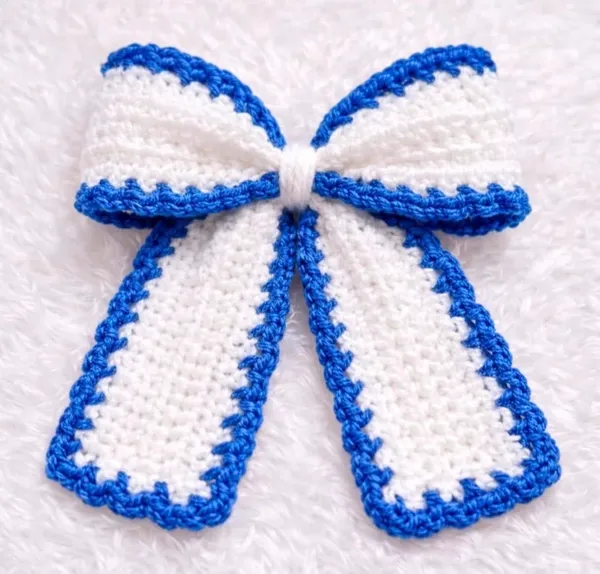 white_bow_with_blue_border_clip