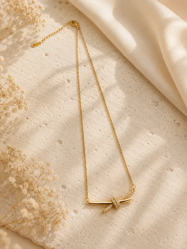 Gold_Tone_Crystal_Embellished_Knot_Design_Pendant_Necklace