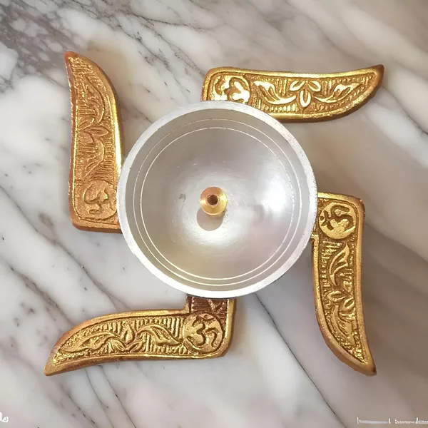 Xenoncraft_Swastik_Brass_Akhand_Diya_With_Velvet_Box_For_Puja,_Diwali_&_Housewarming_Gift_Decorative_Showpiece_-_4.5_Cm_(Silver_Plated,_Gold_Plated,_Gold,_Silver)