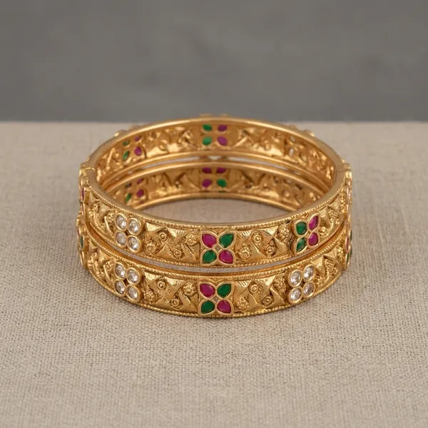 Golden_Floral_Embossed_Bangles_with_Pink_and_Green_Stones