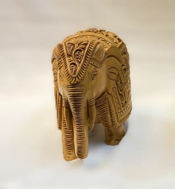 Masterpiece_Hand-Carved_Solid_Wood_Elephant_with_Detailed_Wildlife_Panels_–_Natural_Timber_Bas-Relief_Centerpiece