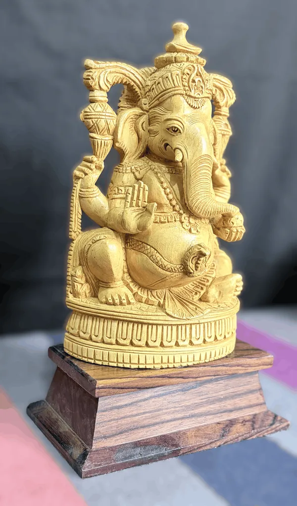 Hand-Carved_Kadam_Wood_Ganesha_Idol_with_Temple_Prabhavali_on_Dark_Hardwood_Base_Vastu_&_Mandir_Decor