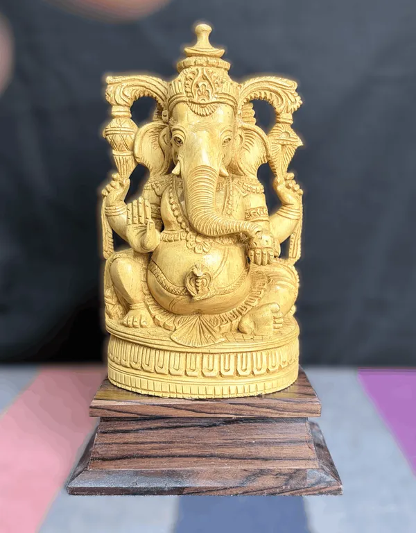 Hand-Carved_Kadam_Wood_Ganesha_Idol_with_Temple_Prabhavali_on_Dark_Hardwood_Base_Vastu_&_Mandir_Decor