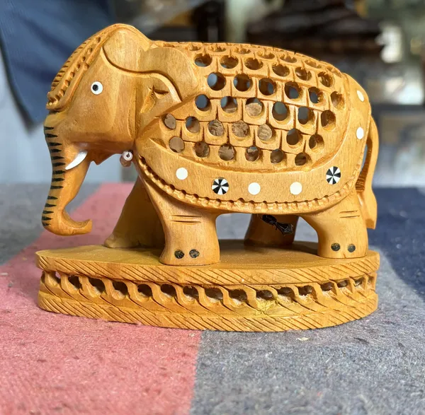 Hand-Carved_Kadam_Wood_Undercut_Elephant_with_Baby_Inside_Single-Block_Jali_Openwork_Fretwork_Showpiece_Maternal_Vastu_Decor