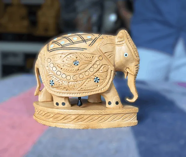 Hand-Carved_Wooden_Elephant_with_Inlay_Work_Studded_Diamond_Trellis_&_Hanging_Underbelly_Bell_Showpiece_Tabletop_Decor