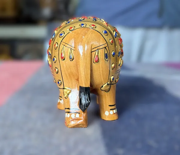 Handcrafted_Golden_Embossed_Wooden_Elephant_Figurine_Traditional_3D_Relief_Floral_Art_Showpiece