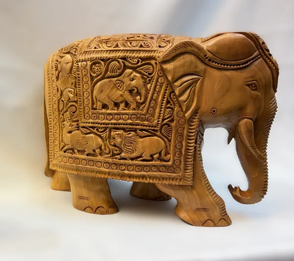 Masterpiece_Hand-Carved_Solid_Wood_Elephant_with_Detailed_Wildlife_Panels_Natural_Timber_Bas-Relief_Centerpiece