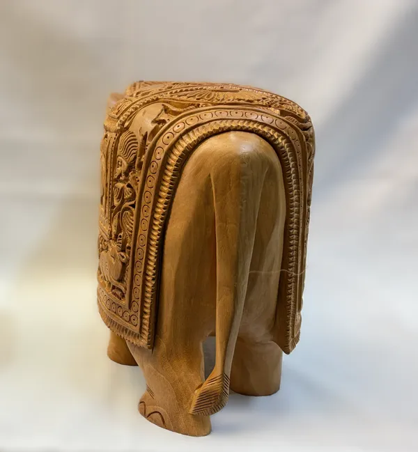 Masterpiece_Hand-Carved_Solid_Wood_Elephant_with_Detailed_Wildlife_Panels_–_Natural_Timber_Bas-Relief_Centerpiece