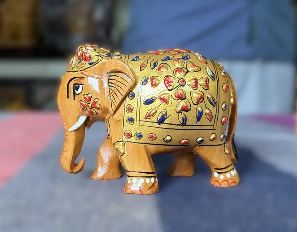 Handcrafted_Golden_Embossed_Wooden_Elephant_Figurine_Traditional_3D_Relief_Floral_Art_Showpiece