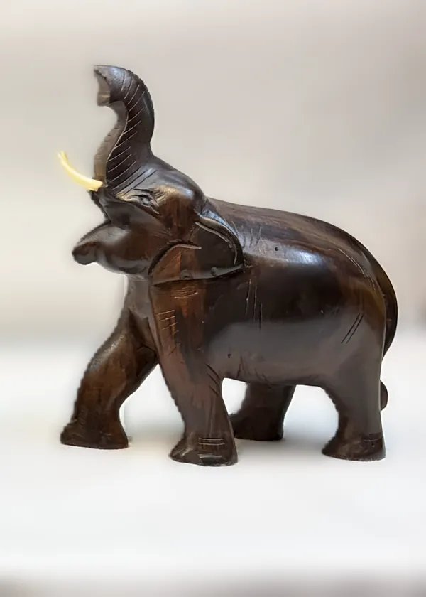 Hand-Carved_Solid_Rosewood_Elephant_with_Raised_Trunk_–_Authentic_Indian_Hardwood_Sculpture_for_Good_Luck_&_Prosperity