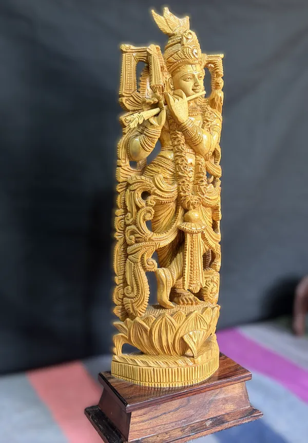 Hand-Carved_Kadam_Wood_Krishna_Playing_Flute_with_Pierced_Prabhavali_Arch_on_Hardwood_Base_–_Tribhanga_Mandir_&_Living_Room_Decor
