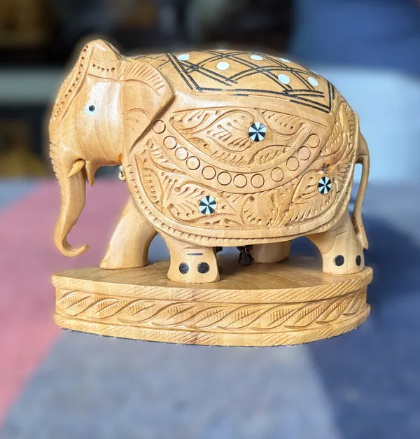 Hand-Carved_Wooden_Elephant_with_Inlay_Work_–_Studded_Diamond_Trellis_&_Hanging_Underbelly_Bell_Showpiece_Tabletop_Decor