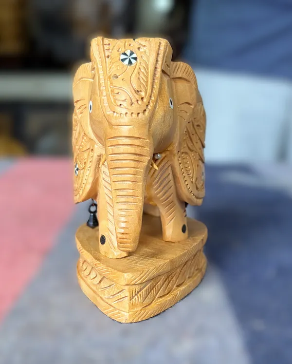 Hand-Carved_Wooden_Elephant_with_Inlay_Work_–_Studded_Diamond_Trellis_&_Hanging_Underbelly_Bell_Showpiece_Tabletop_Decor