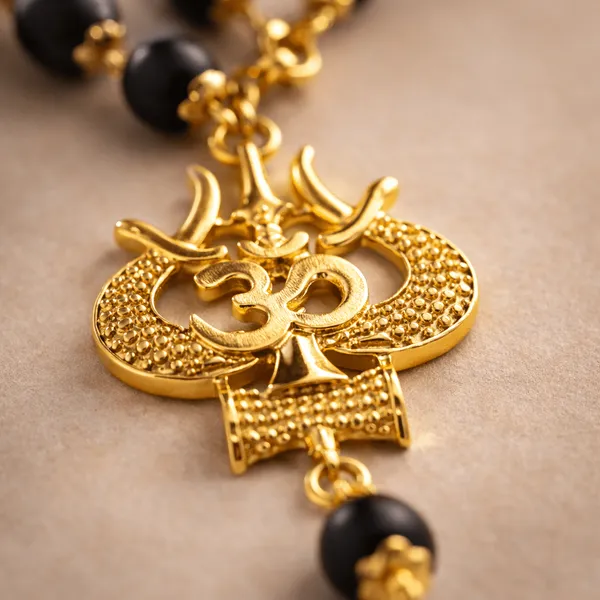 Premium_Black_Karungali_Mala_with_Gold_Om_Trishul_Pendant