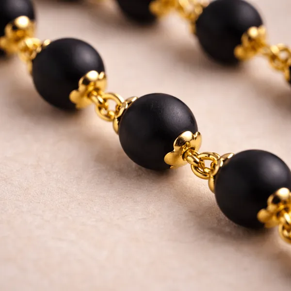 Premium_Black_Karungali_Mala_with_Gold_Om_Trishul_Pendant