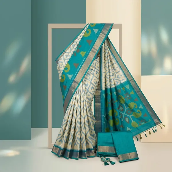 Cream_And_Teal_Green_Ikat_Print_Soft_Silk_Saree_With_Floral_Border